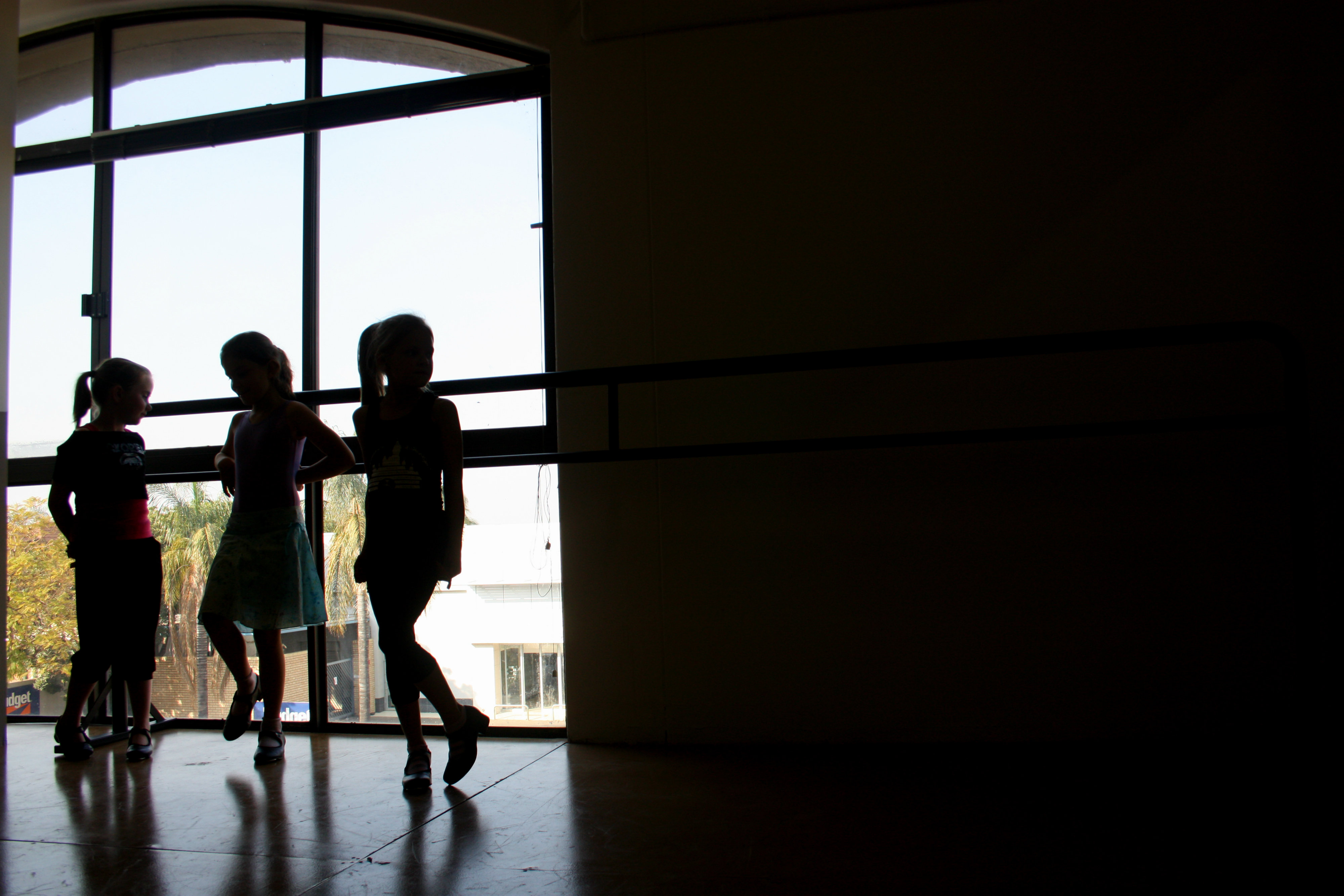 SELF-OBSERVATION. A girl looks at her reflection in

a mirror during a tap dance class at the Dance De’Art dance school in Hatfield, 

Pretoria. Her class mates are waiting their turn to showcase their dance routines. 

Photo: Andrea Küsel.